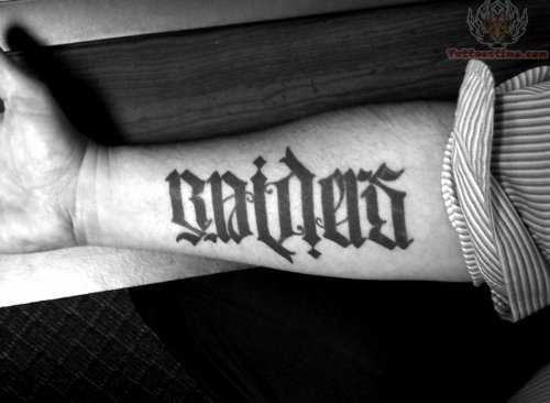 Raiders Word Tattoo On Arm